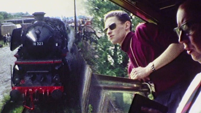 Blick auf eine Dampflok und einem Mann mit Sonnenbrille, der während der Fahrt aus einem Bahnabteil schaut. (Foto: SWR, SWR -)